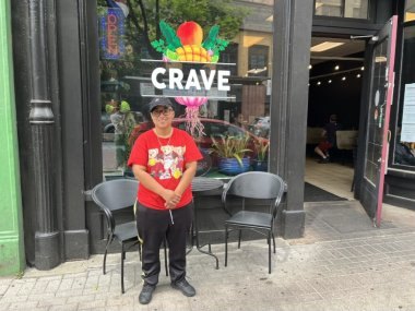 Nicole Ortiz standing in front of her restaurant, Crave, on High Street in Holyoke.